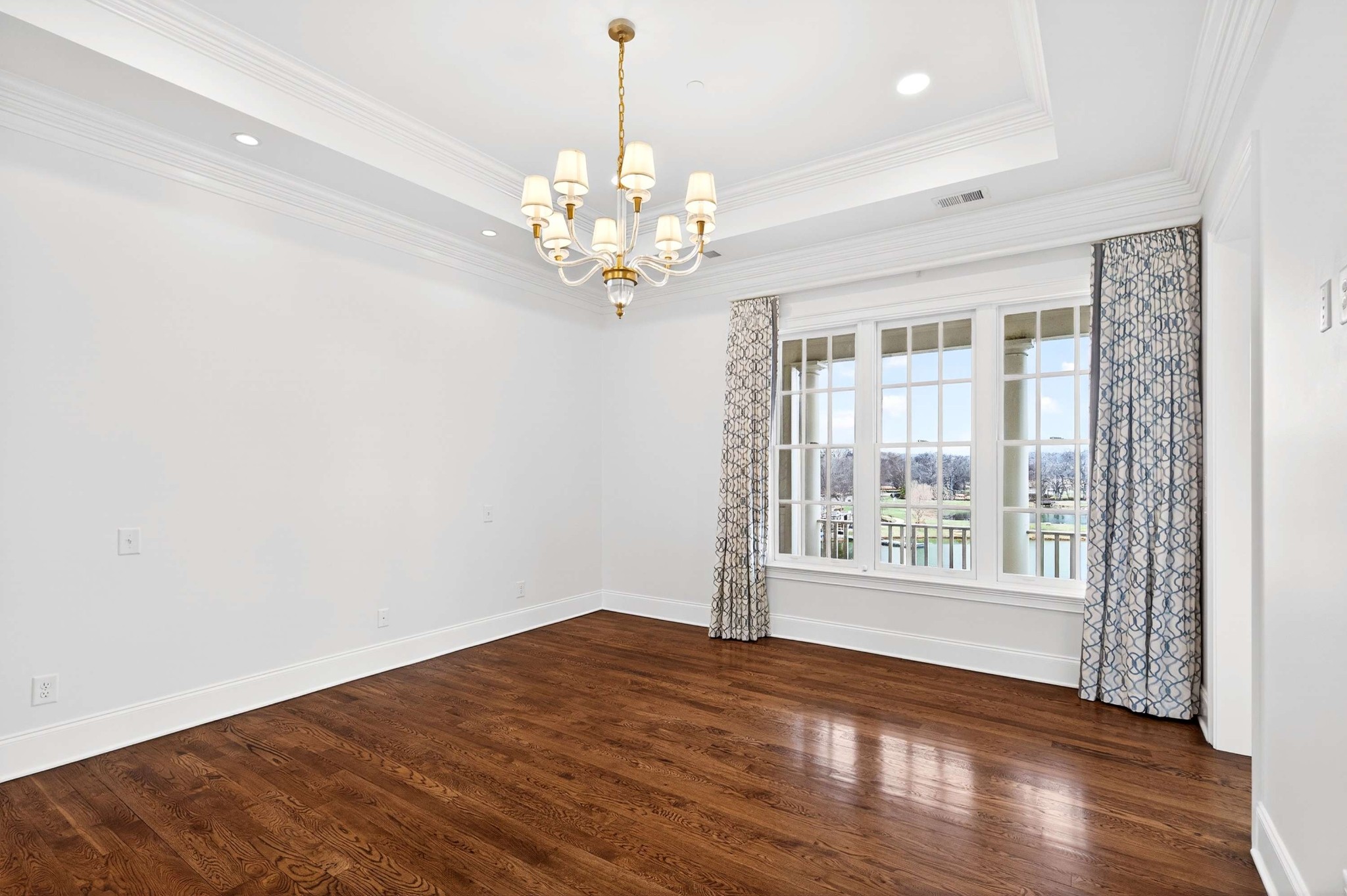 165 Front Street Franklin, TN 37064 - Photo 48 of 63 a view of an empty room with wooden floor and a window