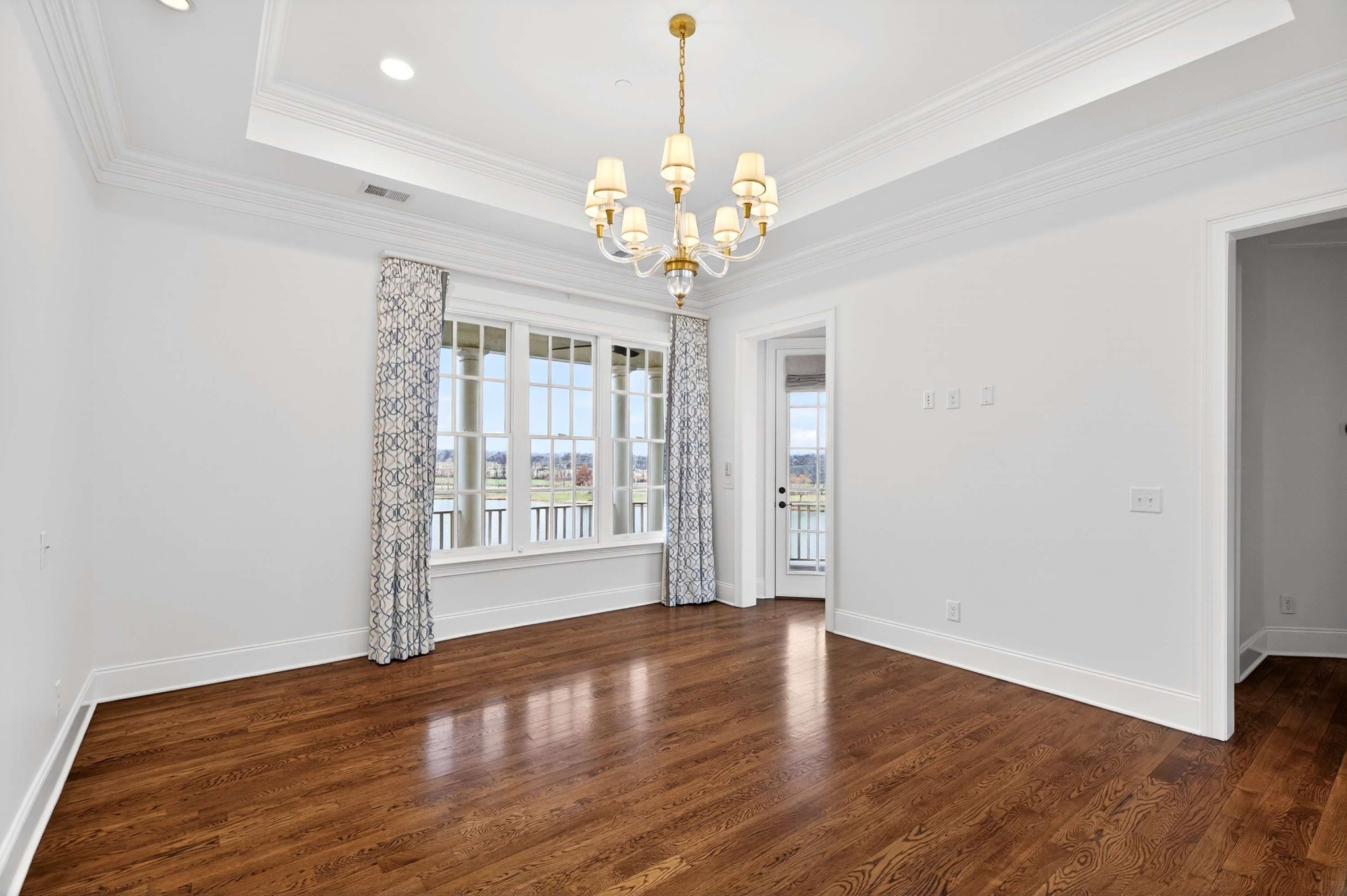 165 Front Street Franklin, TN 37064 - Photo 50 of 63 a view of an empty room with wooden floor and a window