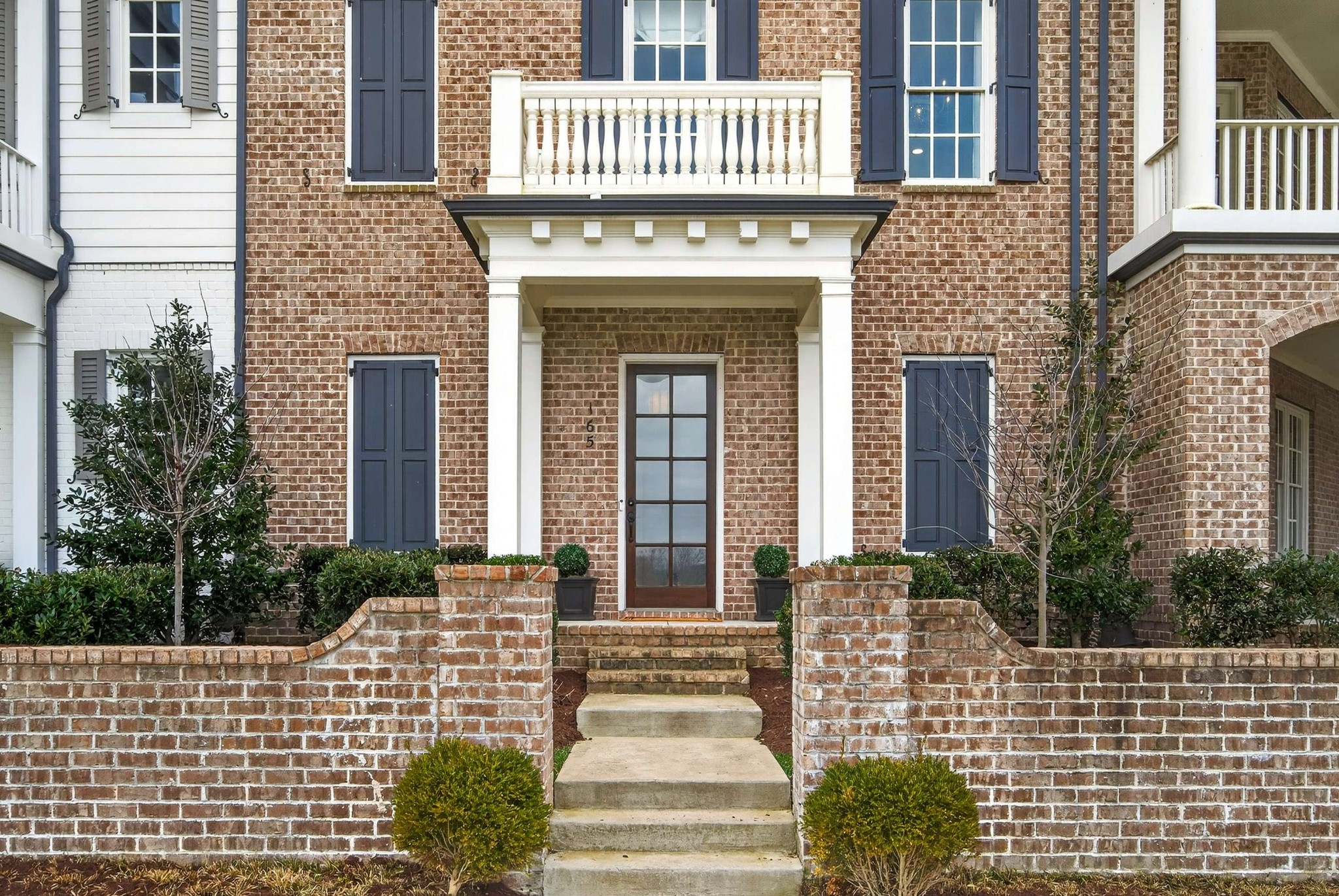 165 Front Street Franklin, TN 37064 - Photo 8 of 63 a front view of a house with a garden