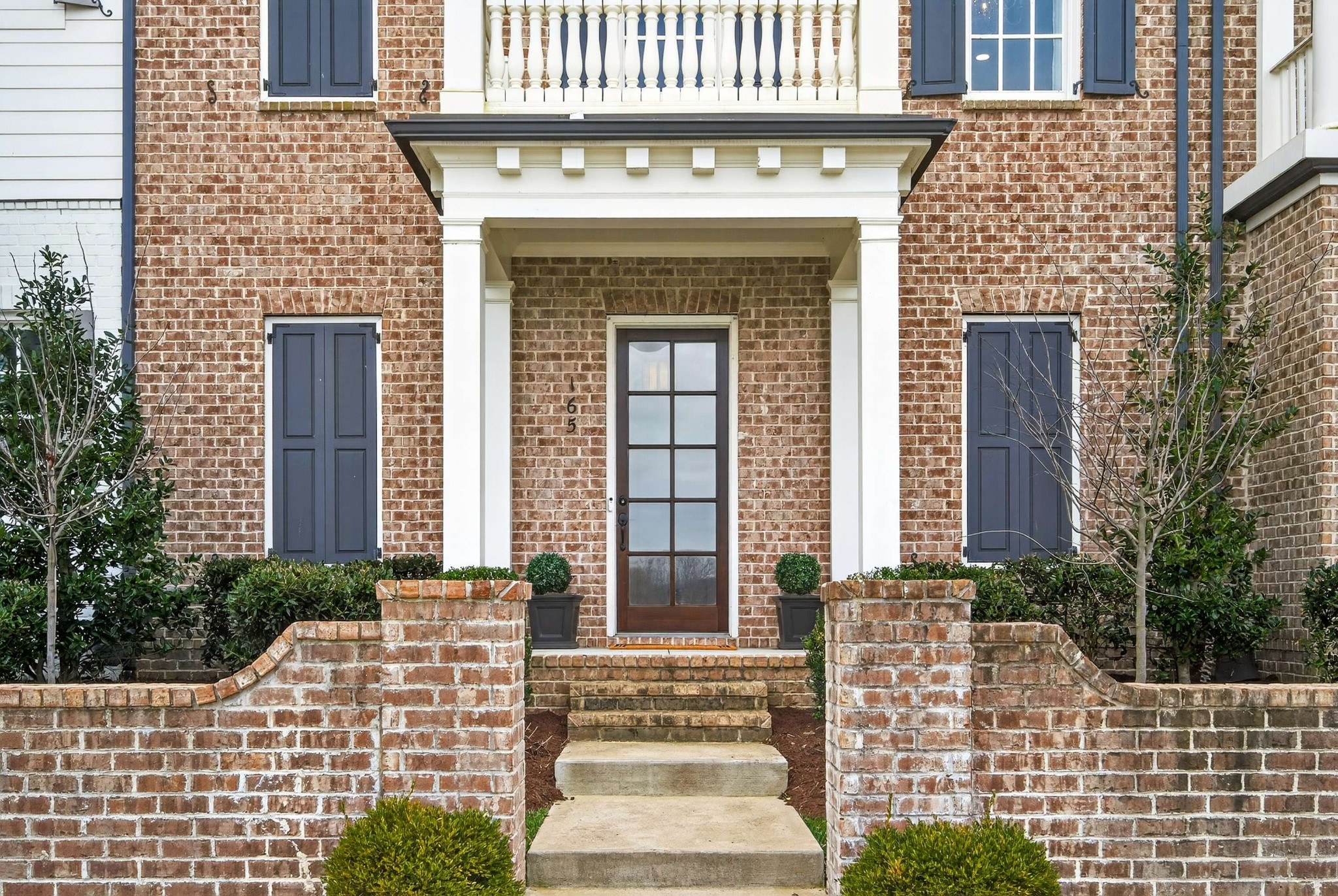 165 Front Street Franklin, TN 37064 - Photo 9 of 63 a front view of a house with a garden