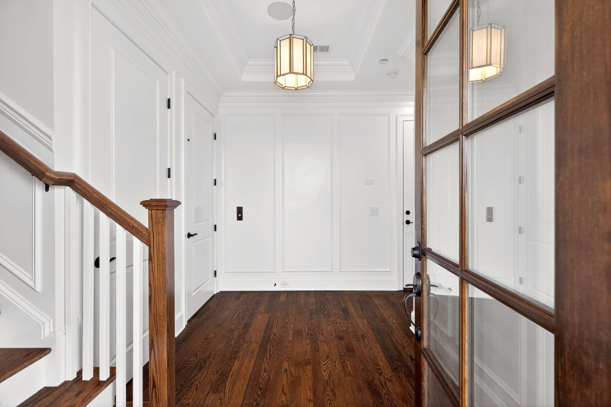 165 Front Street Franklin, TN 37064 - Photo 10 of 63 a view of a hallway with wooden floor and staircase