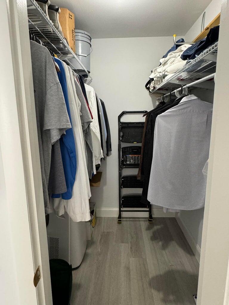 650 Snug Harbor Drive, Unit G110 Boynton Beach, FL 33435 - Photo 14 of 34 a view of walk in closet with clothes and shoes
