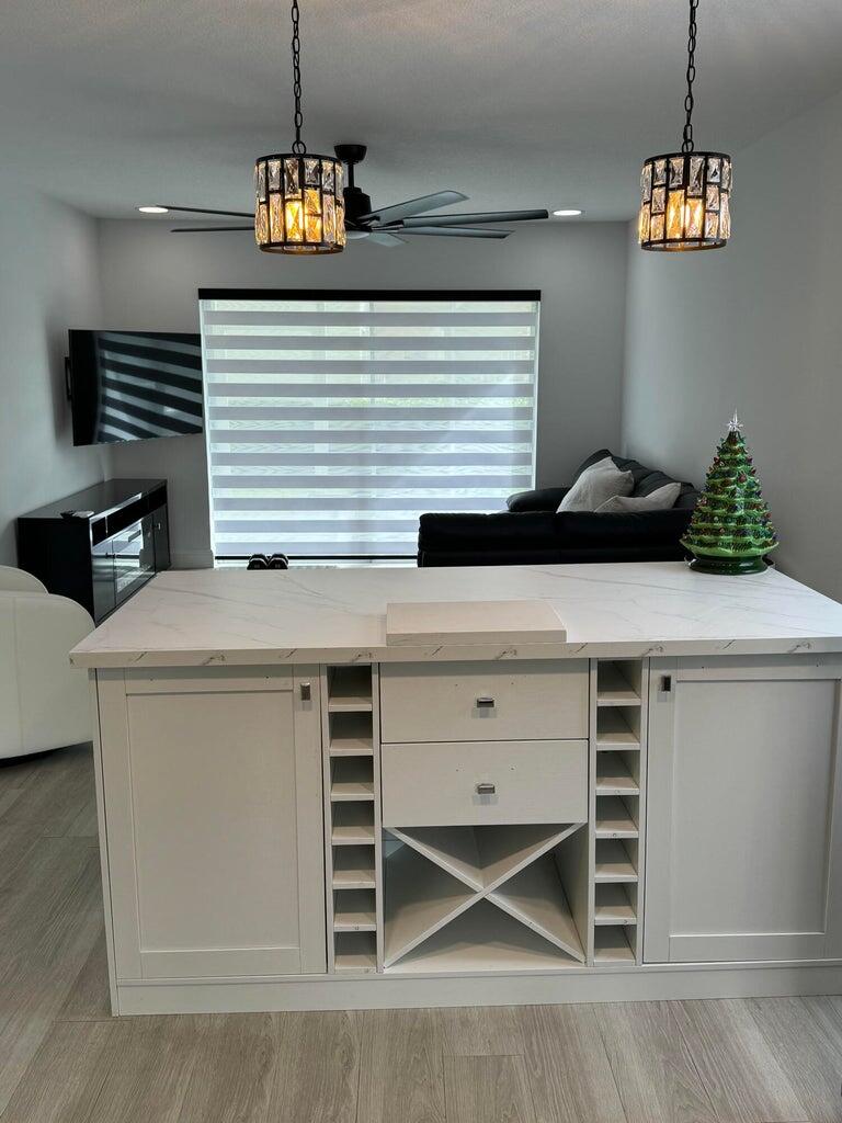 650 Snug Harbor Drive, Unit G110 Boynton Beach, FL 33435 - Photo 7 of 34 a kitchen with a stove and a microwave