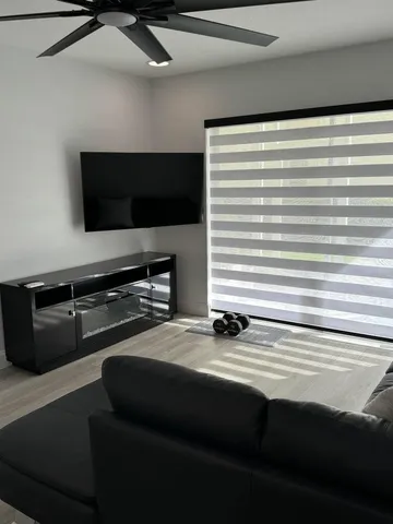 a kitchen with a refrigerator and a stove