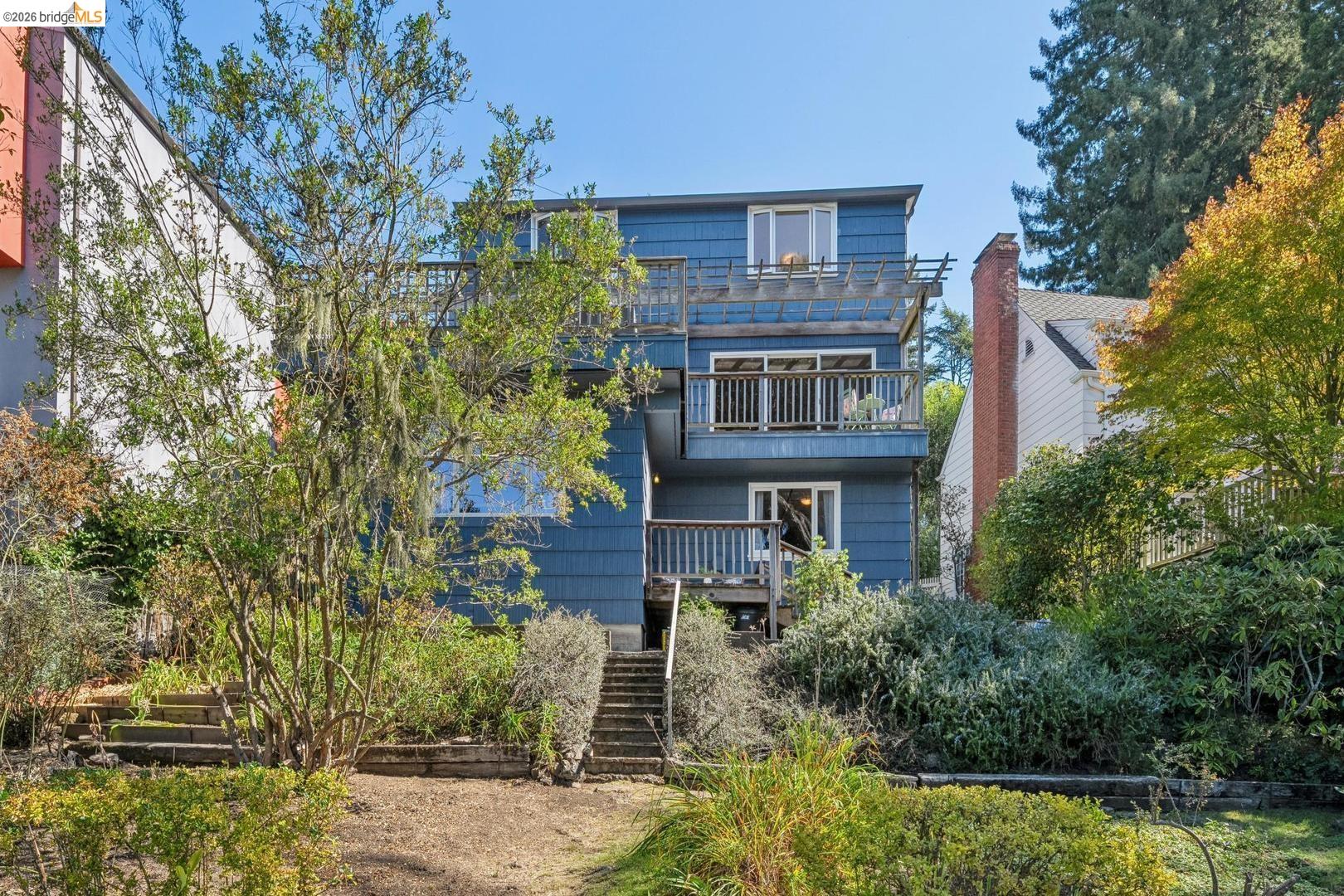 155 Avenida Drive Berkeley, CA 94708 - Photo 62 of 86 Multi-story residence featuring a blue exterior, multiple decks, and extensive landscaping