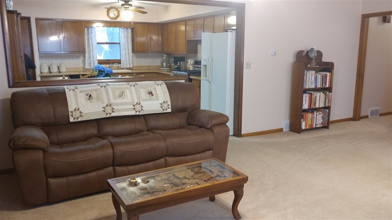 4625 Town Hall Road Belvidere, IL 61008 - Photo 9 of 25 a living room with furniture and a kitchen view