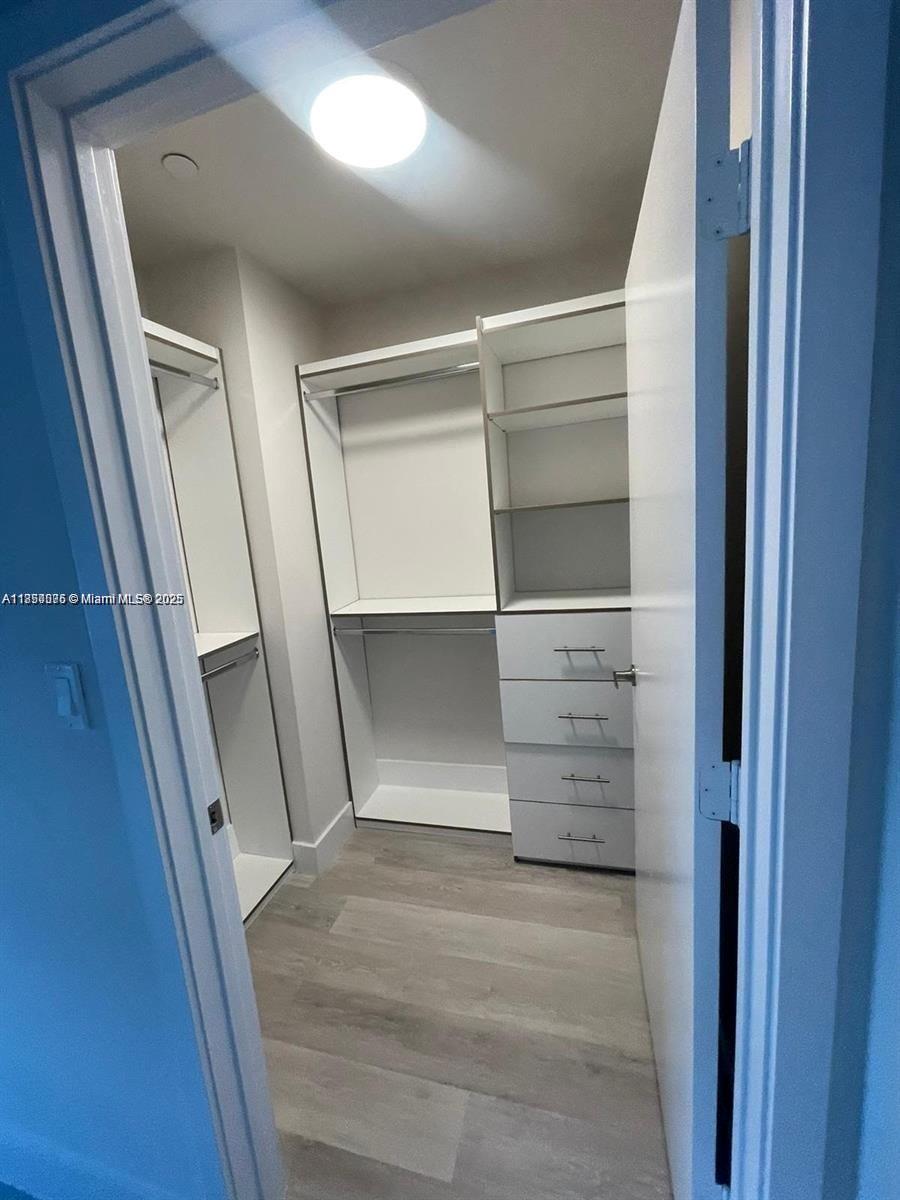 2505 Northeast 193rd Street, Unit 4204 Aventura, FL 33180 - Photo 12 of 18 a view of walk in closet