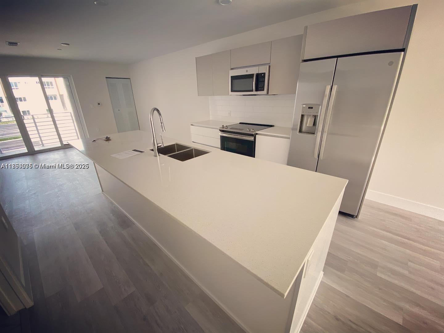 2505 Northeast 193rd Street, Unit 4204 Aventura, FL 33180 - Photo 3 of 18 a large white bed in a white room