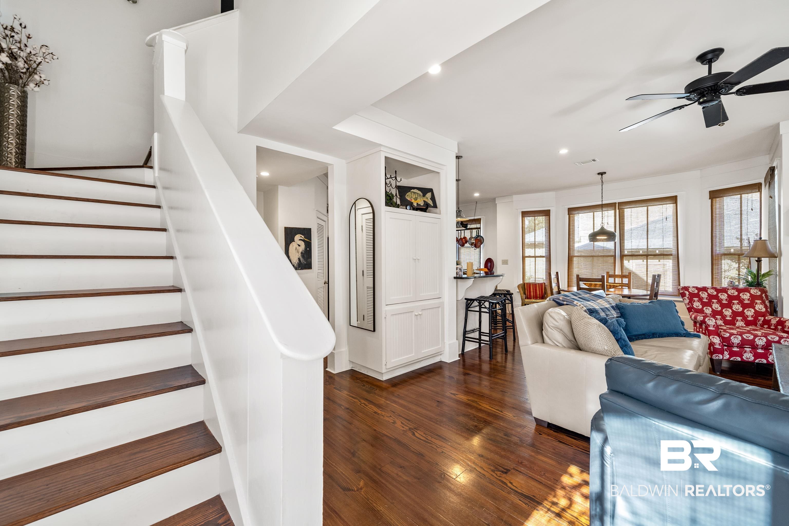 25773 Canal Road, Unit 10 Orange Beach, AL 36561 - Photo 11 of 40 Living room featuring beautiful hardwood floors