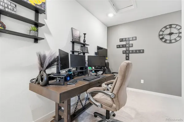 a view of a workspace with furniture