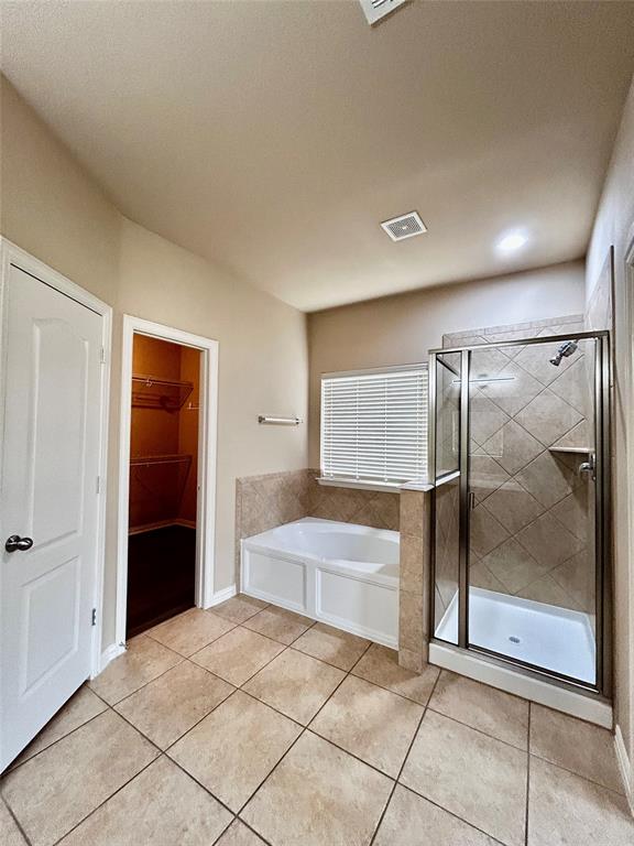 5112 Promised Land Drive McKinney, TX 75071 - Photo 12 of 30 a spacious bathroom with a bathtub and a shower