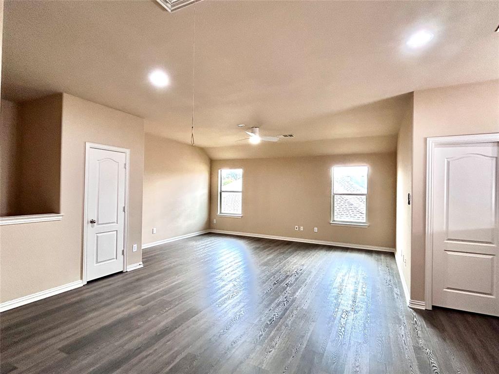5112 Promised Land Drive McKinney, TX 75071 - Photo 14 of 30 a view of a room with wooden floors and white walls