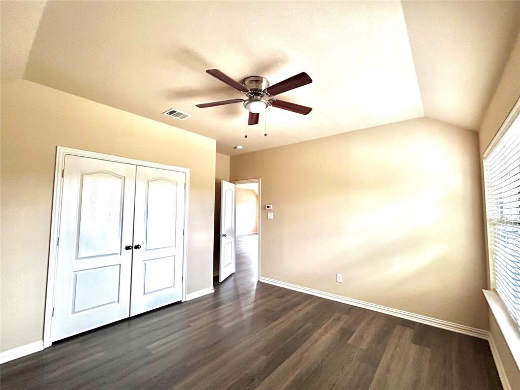 5112 Promised Land Drive McKinney, TX 75071 - Photo 20 of 30 wooden floor in an empty room with a window