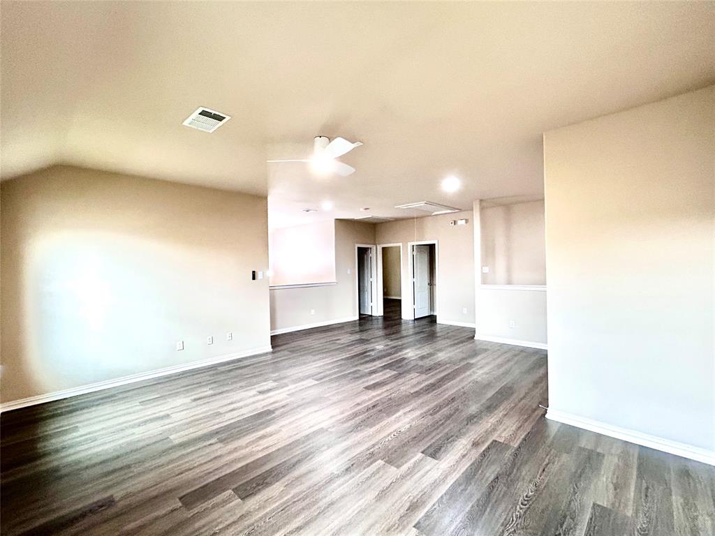 5112 Promised Land Drive McKinney, TX 75071 - Photo 21 of 30 a view of an empty room and wooden floor