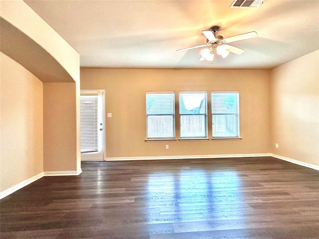 5112 Promised Land Drive McKinney, TX 75071 - Photo 25 of 30 a view of an empty room with a window and wooden floor