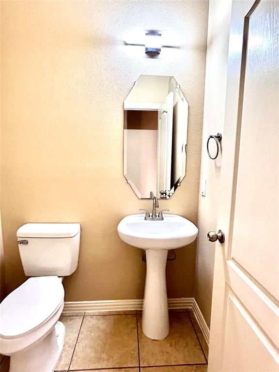 5112 Promised Land Drive McKinney, TX 75071 - Photo 27 of 30 a bathroom with a toilet sink and mirror