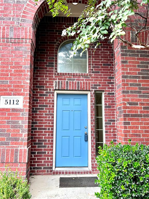 5112 Promised Land Drive McKinney, TX 75071 - Photo 3 of 30 a brick building with a door and a potted plant
