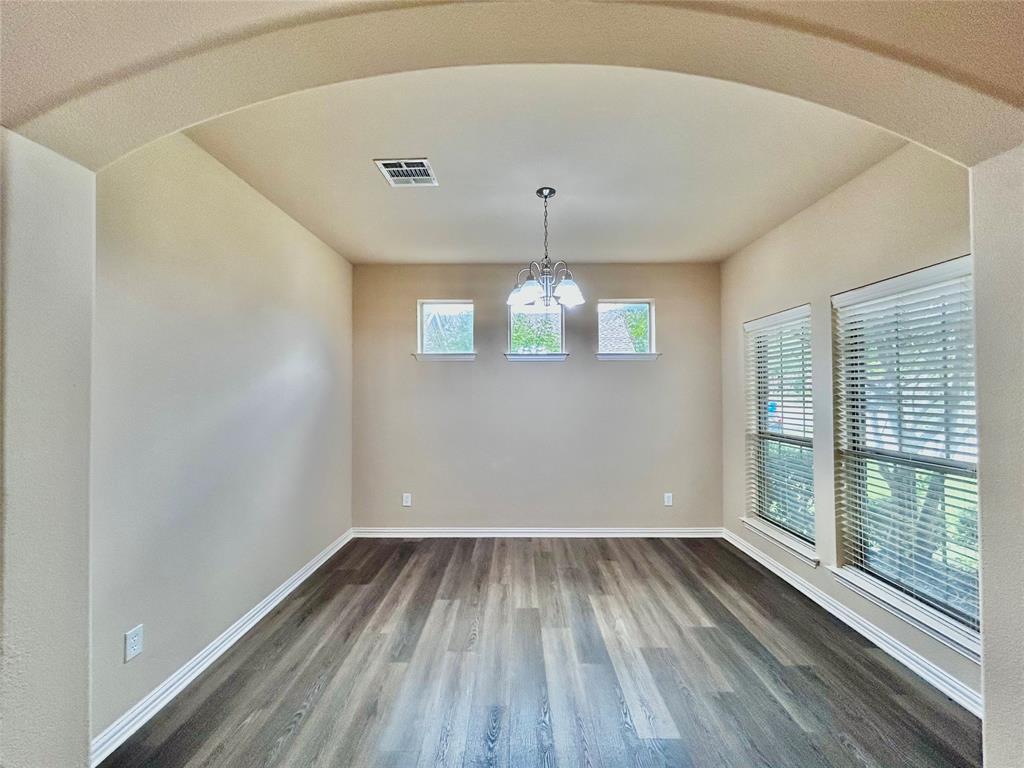 5112 Promised Land Drive McKinney, TX 75071 - Photo 4 of 30 wooden floor in an empty room with a window
