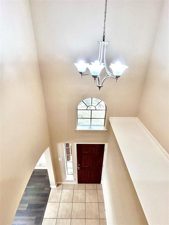 5112 Promised Land Drive McKinney, TX 75071 - Photo 5 of 30 a view of entryway with a chandelier and wooden floor