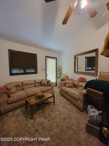a view of balcony with wooden floor and fence