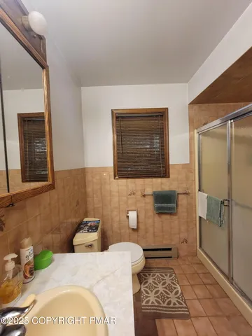 a living room with furniture a rug and a chandelier