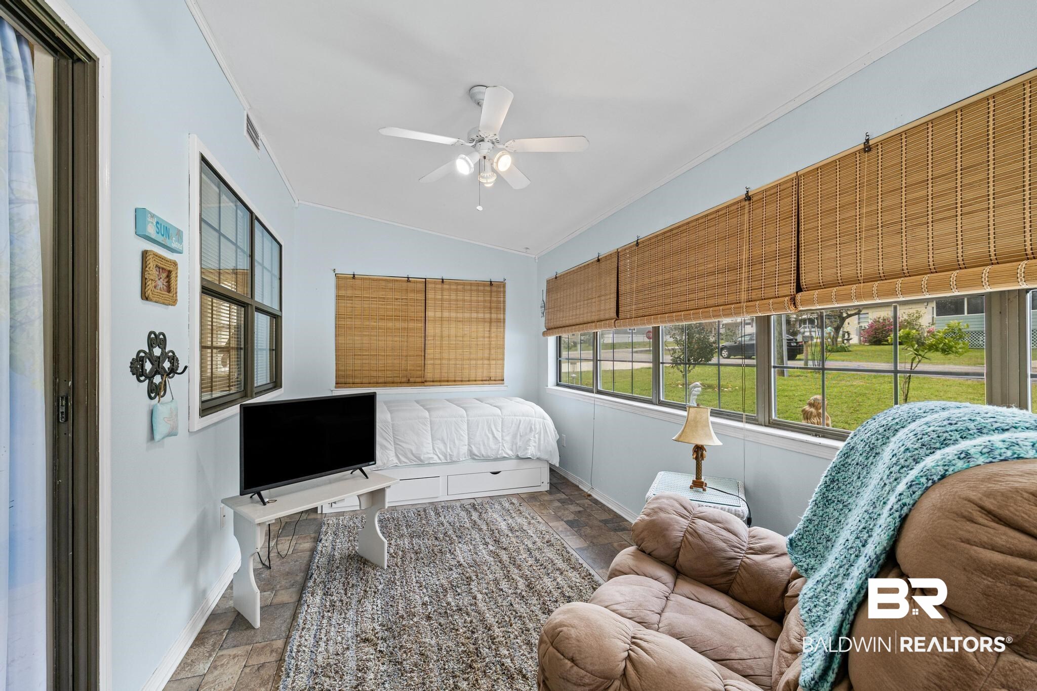 1437 Rio Circle Lillian, AL 36549 - Photo 9 of 46 Bedroom with stone finish flooring, crown molding, a ceiling fan, and vaulted ceiling