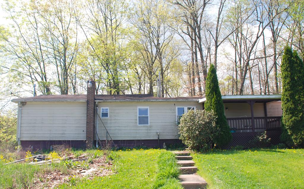 4659 South Mechanicsville Road Clarion, PA 16214 - Photo 1 of 35 a front view of a house with garden