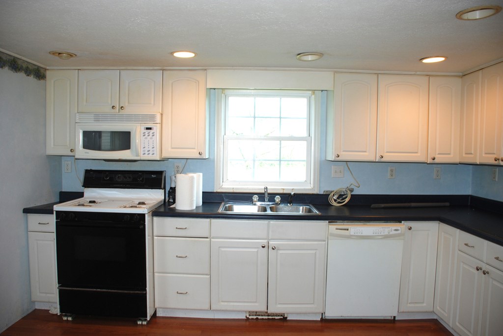 4659 South Mechanicsville Road Clarion, PA 16214 - Photo 11 of 35 a kitchen with granite countertop white cabinets and a stainless steel appliances