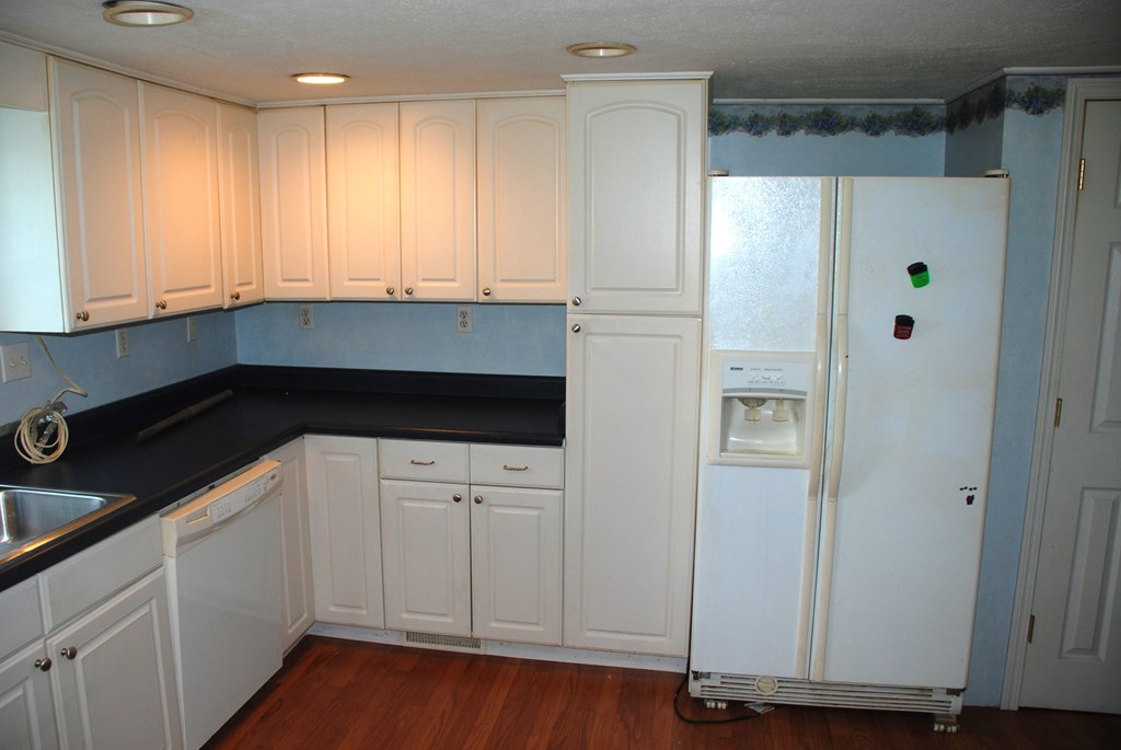 4659 South Mechanicsville Road Clarion, PA 16214 - Photo 13 of 35 a kitchen with stainless steel appliances a refrigerator and white cabinets