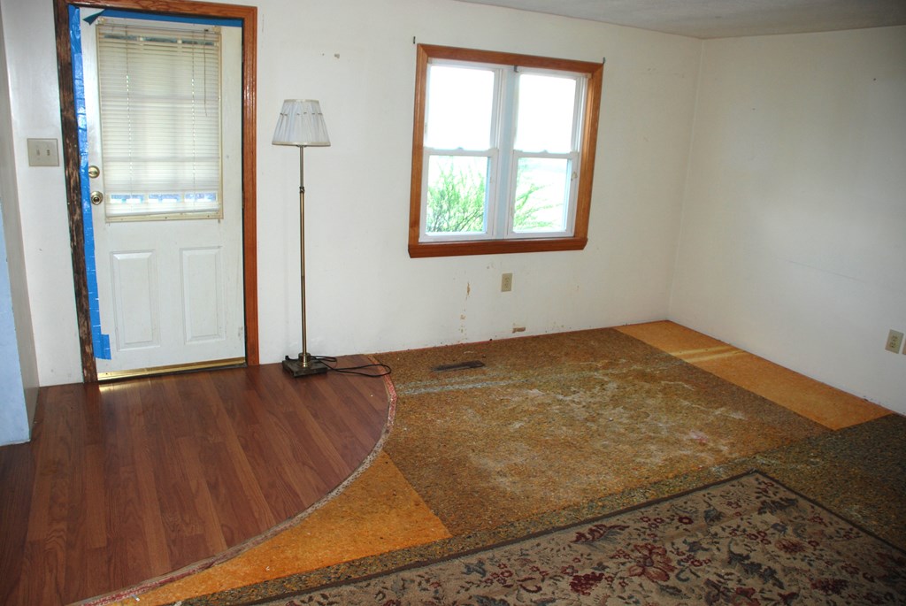 4659 South Mechanicsville Road Clarion, PA 16214 - Photo 16 of 35 an empty room with wooden floor and windows