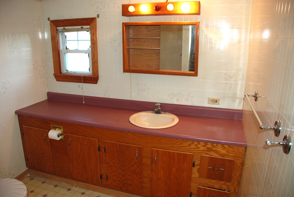 4659 South Mechanicsville Road Clarion, PA 16214 - Photo 18 of 35 a bathroom with a sink and a mirror