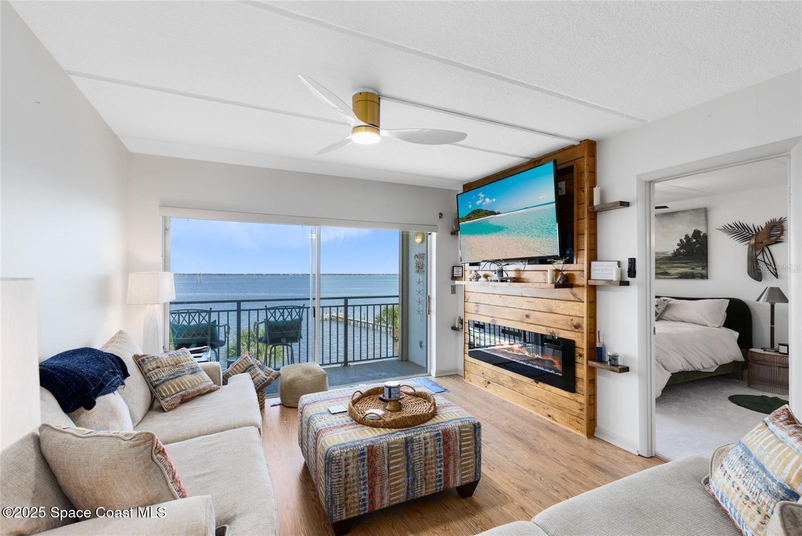 3901 Dixie Highway Northeast, Unit 409 Palm Bay, FL 32905 - Photo 12 of 40 a living room with furniture and a flat screen tv