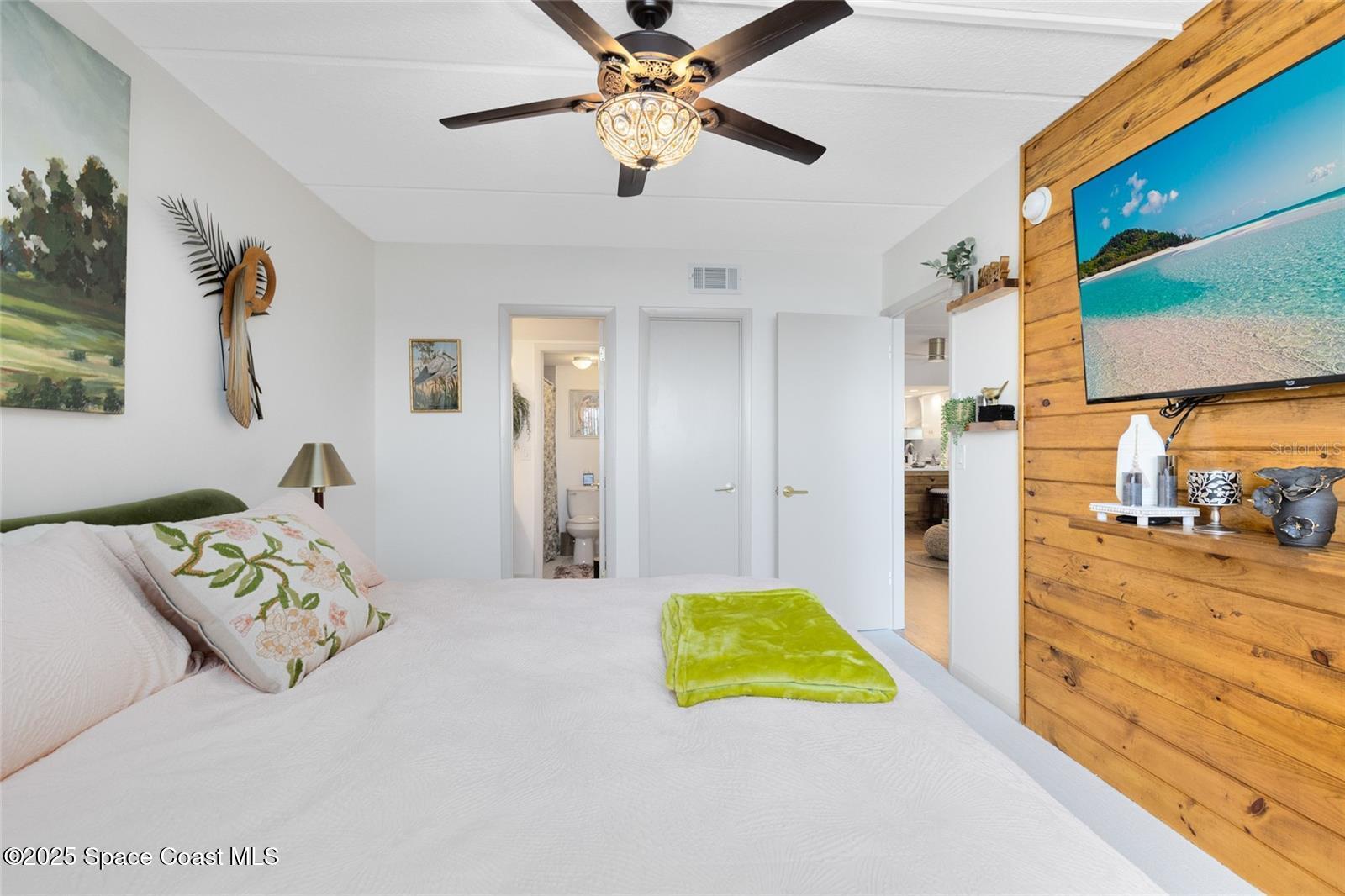 3901 Dixie Highway Northeast, Unit 409 Palm Bay, FL 32905 - Photo 16 of 40 a bedroom with a bed and a view of bedroom