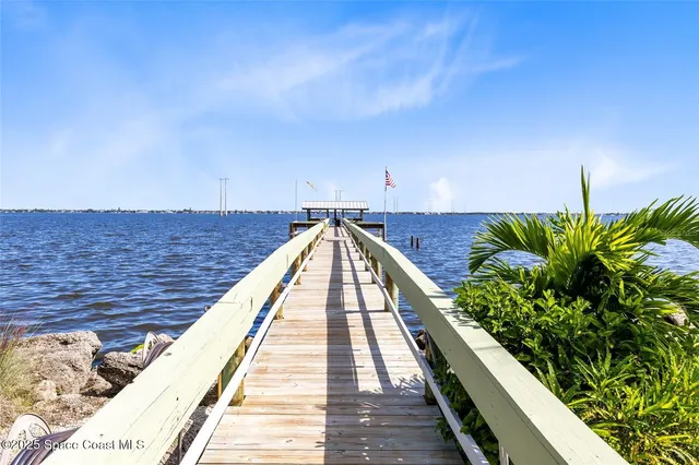 a view of balcony and wooden floor