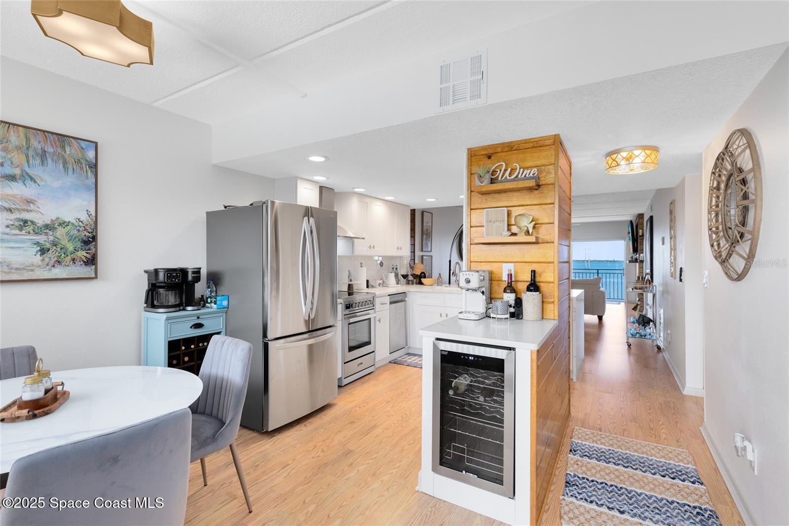 3901 Dixie Highway Northeast, Unit 409 Palm Bay, FL 32905 - Photo 3 of 40 a kitchen with stainless steel appliances kitchen island granite countertop a refrigerator and a stove top oven