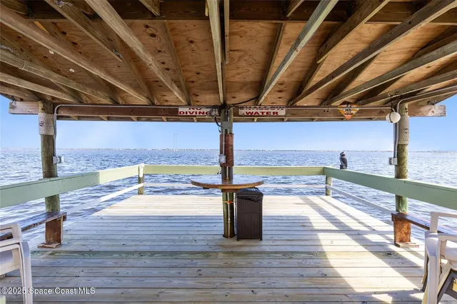 a view of a balcony with wooden floor