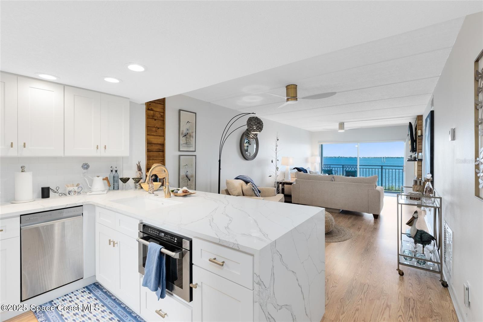 3901 Dixie Highway Northeast, Unit 409 Palm Bay, FL 32905 - Photo 6 of 40 a view of kitchen with sink and refrigerator