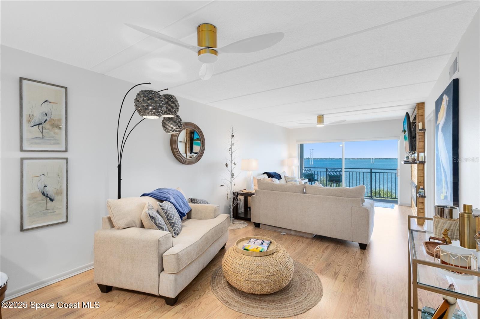 3901 Dixie Highway Northeast, Unit 409 Palm Bay, FL 32905 - Photo 9 of 40 a living room with furniture and a table