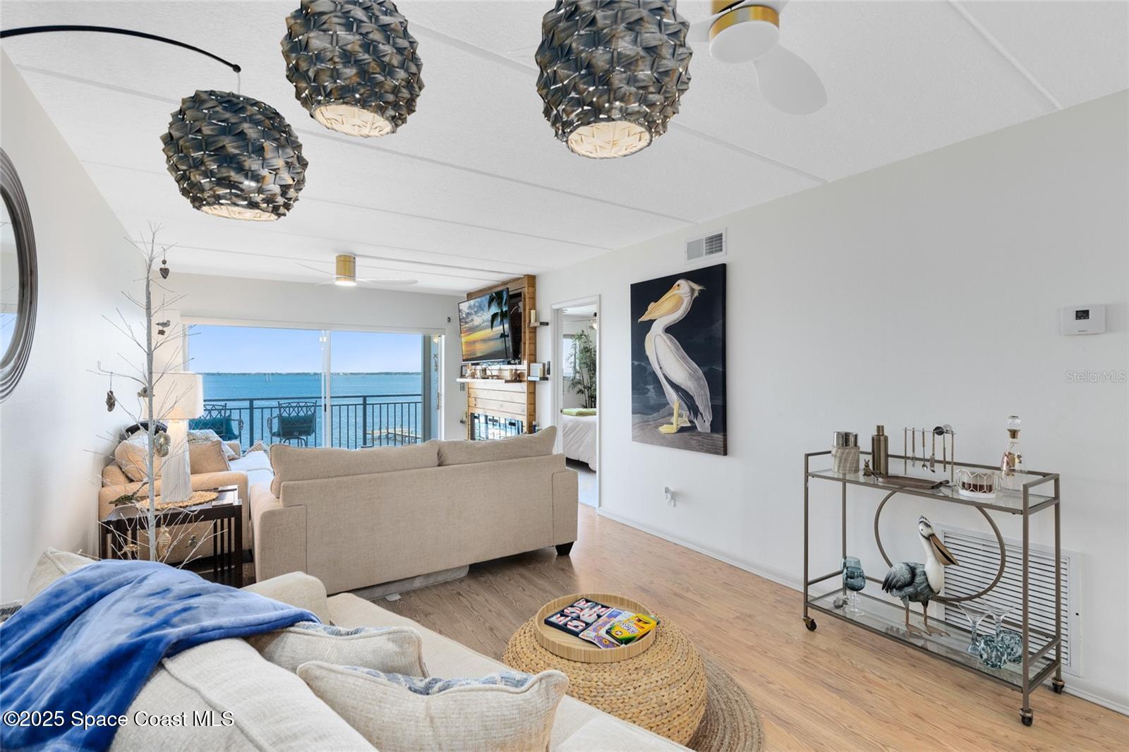 3901 Dixie Highway Northeast, Unit 409 Palm Bay, FL 32905 - Photo 10 of 40 a living room with hard wood flooring and a couch