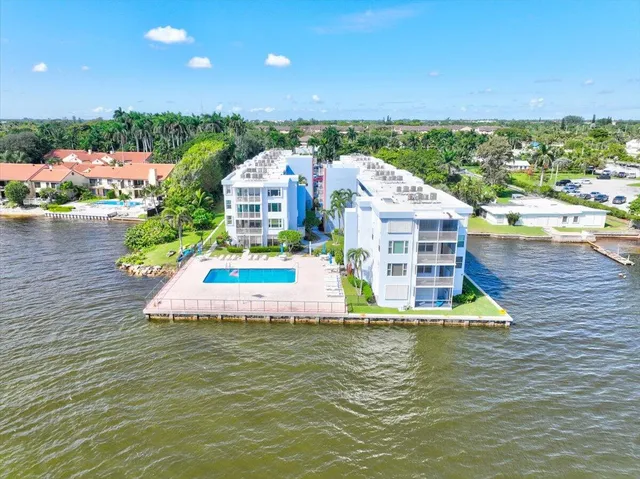 a view of a a dining room with furniture window and wooden floor