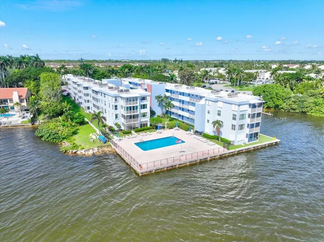 a view of a livingroom with furniture and a flat screen tv