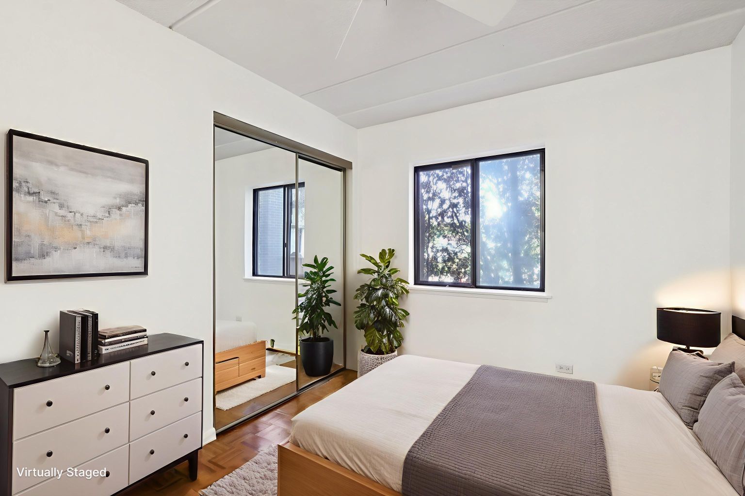 920 Vose Drive, Unit 106 Gurnee, IL 60031 - Photo 7 of 39 a bedroom with a bed and a flat screen tv