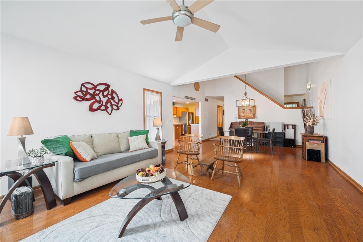 103 Fawn Lane Elgin, IL 60120 - Photo 15 of 31 a living room with furniture and a wooden floor