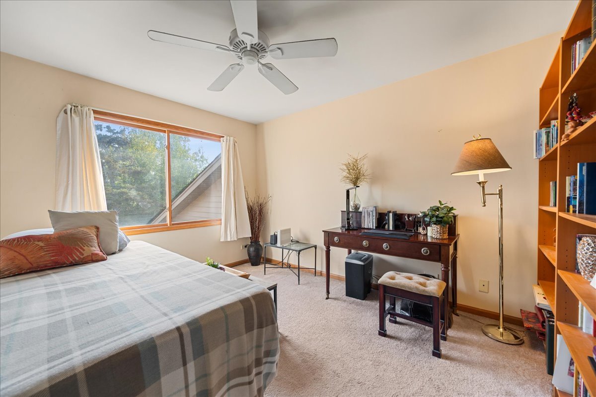 103 Fawn Lane Elgin, IL 60120 - Photo 17 of 31 a bedroom with a bed and a chandelier