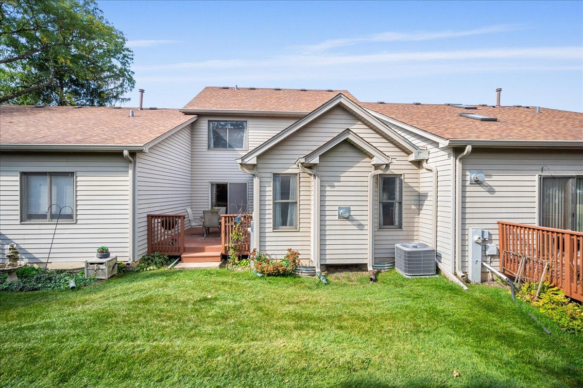 103 Fawn Lane Elgin, IL 60120 - Photo 31 of 31 a front view of a house with a garden and plants