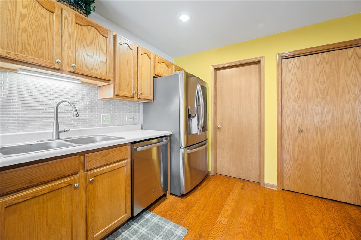103 Fawn Lane Elgin, IL 60120 - Photo 8 of 31 a kitchen with stainless steel appliances a refrigerator and cabinets