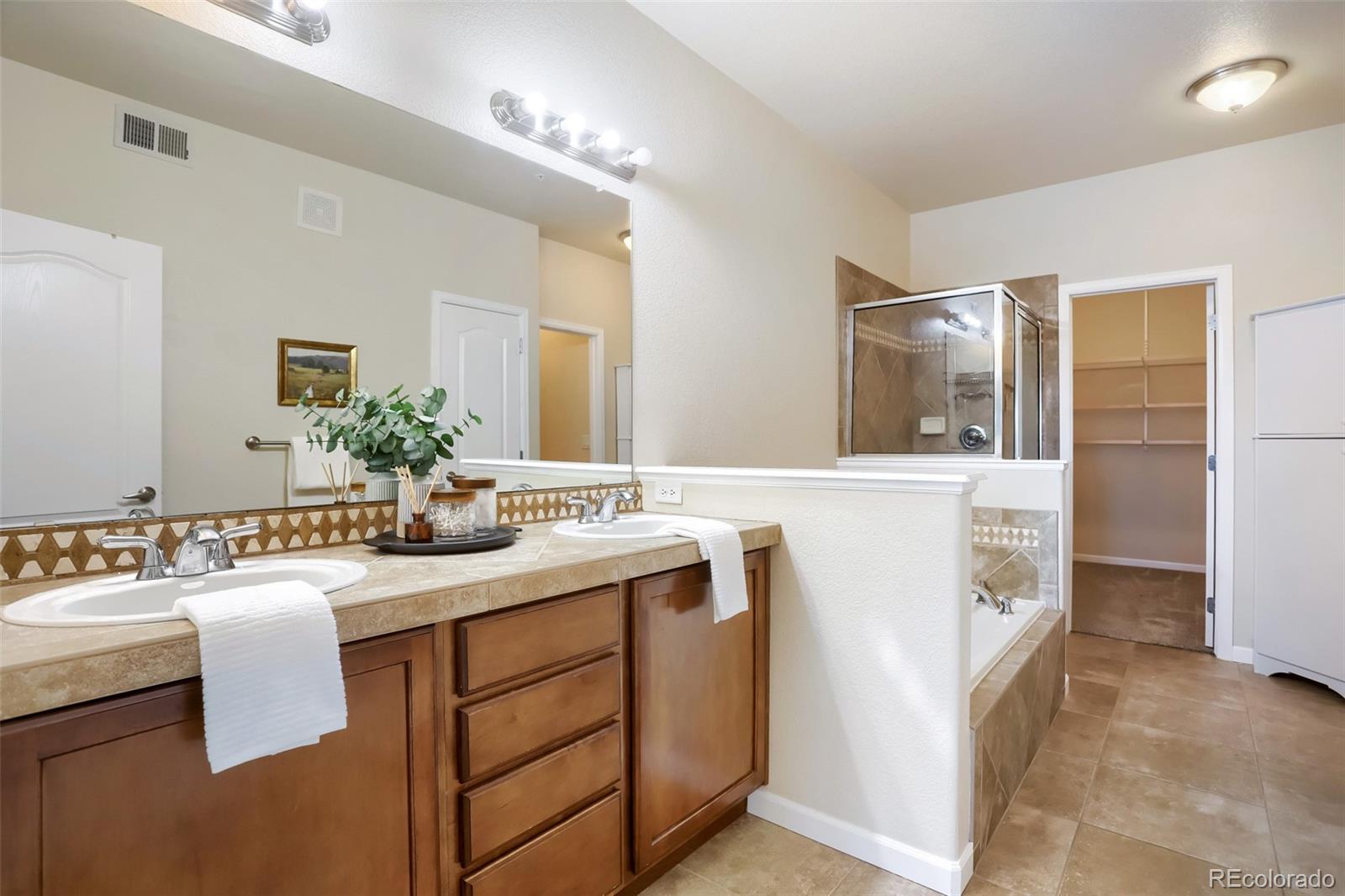 6232 Kilmer Loop, Unit 203 Golden, CO 80403 - Photo 22 of 33 a bathroom with a sink and a mirror