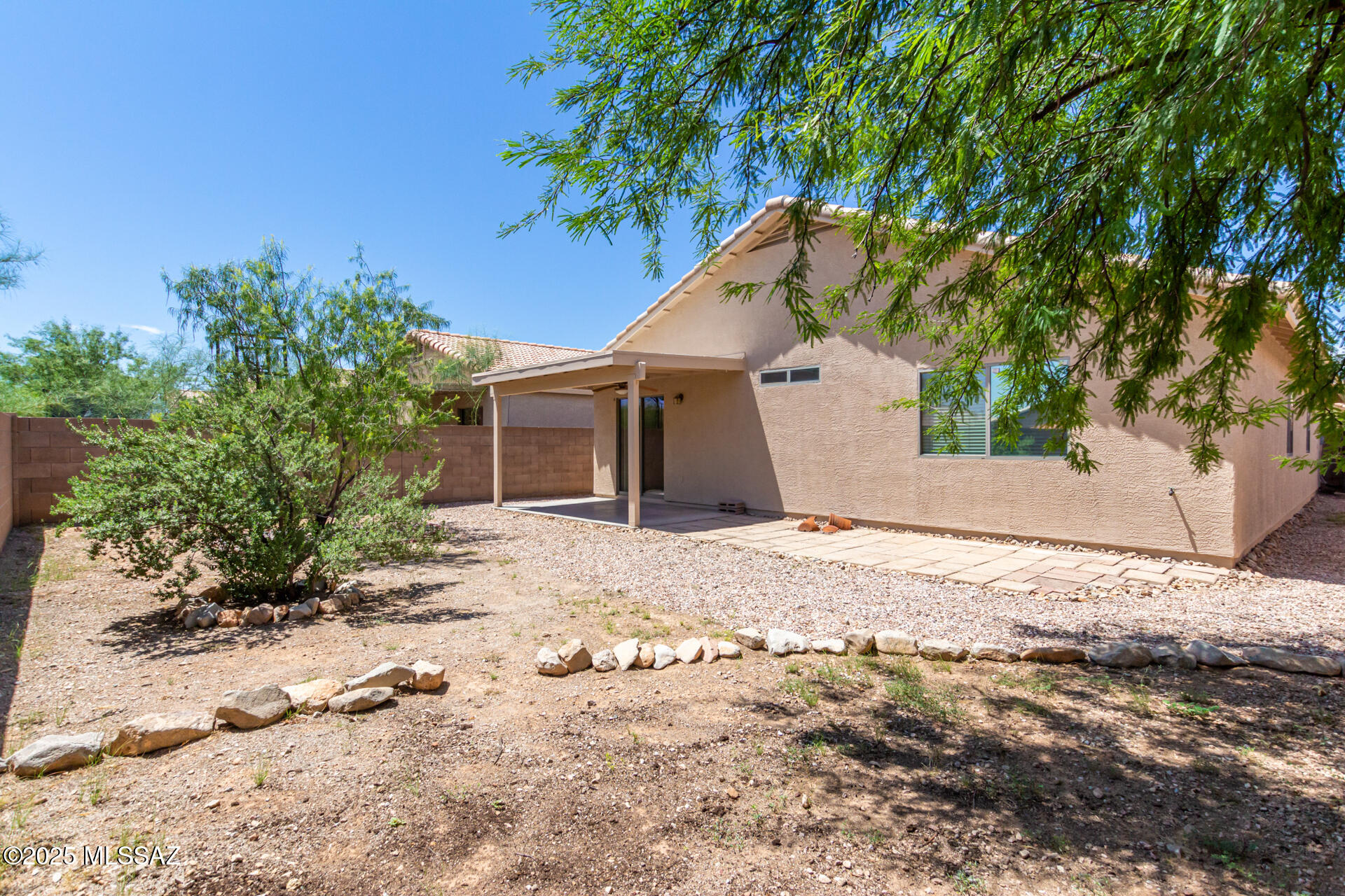 1516 North Old Ranch Road Tucson, AZ 85745 - Photo 24 of 27 a view of a house with a tree in the background
