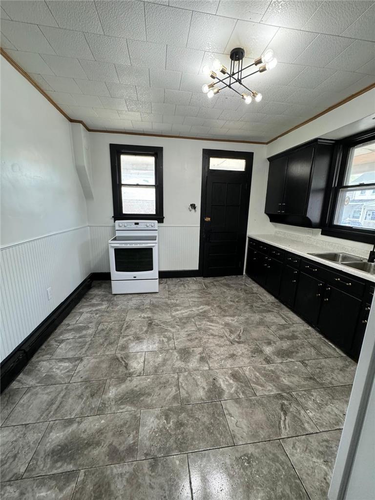 200 South Coal Street Shamokin, PA 17872 - Photo 5 of 18 Striking dark cabinetry contrasts with patterned flooring in this spacious eat-in kitchen.