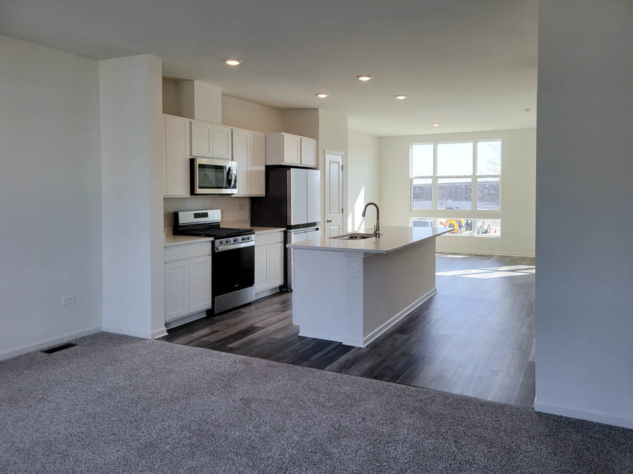 356 Summit Circle Lombard, IL 60148 - Photo 3 of 38 a kitchen with stainless steel appliances a microwave a stove a refrigerator a sink a counter top space and cabinets